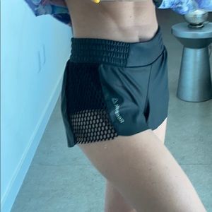 Black Reebok coated running shorts with mesh sides